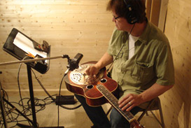 Mike Johnson, studio musician in Nashville, Tennessee, playing steel guitar in Panda Productions Nashville recording studios